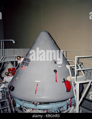 View of Spacecraft 012 Command Module during installation of heat ...