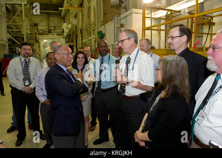 NASA Administrator Charles Bolden got a firsthand look at work being done on the four Magnetospheric Multiscale (MMS) spacecraft during his visit to the agency's Goddard Space Flight Center in Greenbelt, Maryland, on May 12.  Standing 20 feet high inside a Goddard clean room, the spacecraft were in their 'four-stack' formation, similar to how they will be arranged inside their launch vehicle. The MMS spacecraft recently completed vibration testing.  With MMS as a backdrop, Bolden and Goddard Center Director Chris Scolese discussed the mission, ground testing and preparations for launch with pr Stock Photo