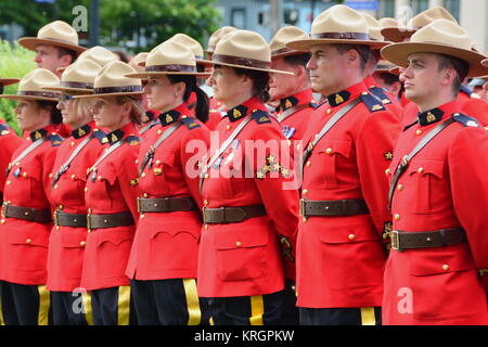 RCMP police officers stand at attention in honor of fallen officers who gave their lives for their communities. Stock Photo