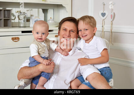 Happy father with two sons. Stock Photo