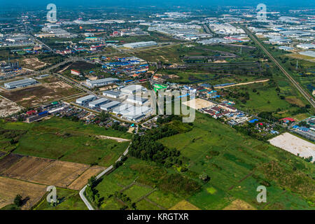 Farm land and construction in industrial estate Stock Photo