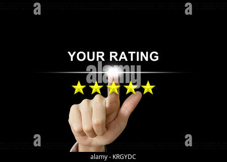 business hand pushing your rating on screen Stock Photo