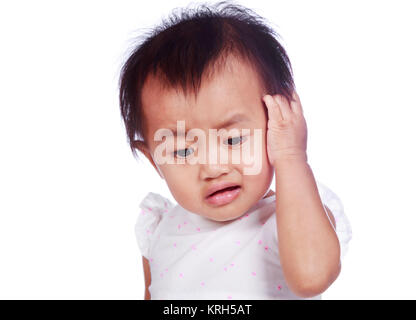 sad baby in depression tearing hair on head isolated on a white background Stock Photo