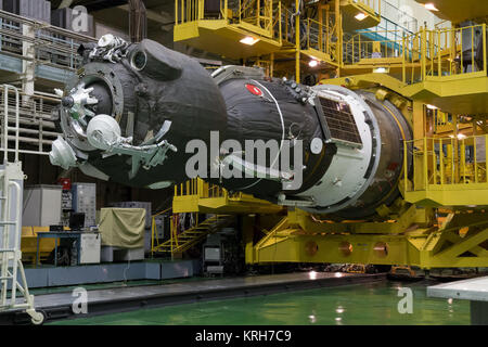 2014-09-18-12-46-56 At the Integration Facility at the Baikonur Cosmodrome in Kazakhstan, the Soyuz TMA-14M spacecraft awaits its encapsulation in the upper stage of the Soyuz booster rocket Sept. 18 that will propel it into orbit. The Soyuz will arrive at its launch pad on Sept. 23 for final pre-launch preparations. Expedition 41/42 Flight Engineer Barry Wilmore of NASA, Soyuz Commander Alexander Samokutyaev of the Russian Federal Space Agency (Roscosmos) and Flight Engineer Elena Serova of Roscosmos will launch aboard the Soyuz Sept. 26, Kazakh time, to begin a 5 ½ month mission on the Inter Stock Photo