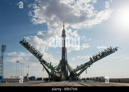 The gantry arms begin to close around the Soyuz TMA-14M spacecraft to secure the rocket at the launch pad Sept. 23, 2014 at the Baikonur Cosmodrome in Kazakhstan. Launch of the Soyuz rocket is scheduled for Sept. 26 and will carry Expedition 41 Soyuz Commander Alexander Samokutyaev of the Russian Federal Space Agency (Roscosmos), Flight Engineer Barry Wilmore of NASA, and Flight Engineer Elena Serova of Roscosmos into orbit to begin their five and a half month mission on the International Space Station. Photo Credit: (NASA/Joel Kowsky) Expedition 41 Rollout (201409230005HQ) Stock Photo