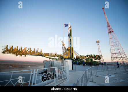 The Soyuz TMA-15M spacecraft is seen after being raised into a vertical position on the launch pad on Friday, Nov. 21, 2014 at the Baikonur Cosmodrome in Kazakhstan.  Launch of the Soyuz rocket is scheduled for Nov. 24 and will carry Expedition 42 Soyuz Commander Anton Shkaplerov of the Russian Federal Space Agency (Roscosmos), Flight Engineer Terry Virts of NASA , and Flight Engineer Samantha Cristoforetti of the European Space Agency into orbit to begin their five and a half month mission on the International Space Station. Photo Credit: (NASA/Aubrey Gemignani) Expedition 42 Soyuz Rollout (2 Stock Photo