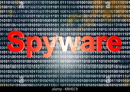 Spyware in the code. Typography in front of digital, binary background. Stock Photo