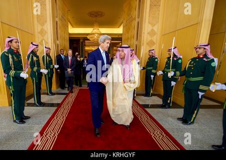 U.S. Secretary of State John Kerry walks with Saudi Arabian Foreign Minister Adel al-Jubeir outside the Royal Court December 18, 2016 in Riyadh, Saudi Arabia. Stock Photo