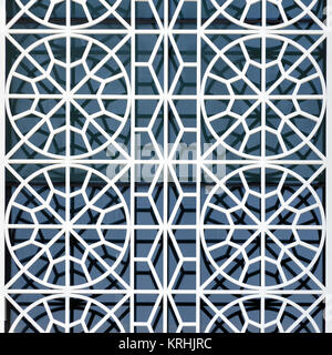 Concept of the architectural design of the exterior of the buildings is a beautiful ornament of the protective grid on the window. Abstract background Stock Photo