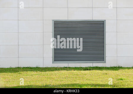 Lattice shutters vent cover on the wall of the house. Stock Photo