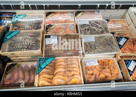 Frozen king prawns, langoustines and seafood in a Spanish supermarket Stock Photo