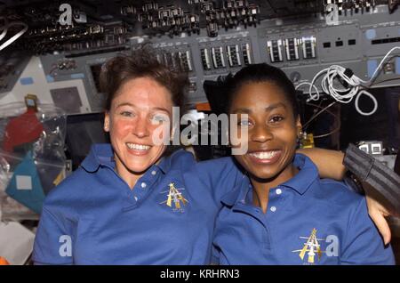 NASA Space Shuttle Discovery International Space Station STS-121 mission prime crew members American astronauts Lisa Nowak (left) and Stephanie Wilson float in the flight deck aboard the Discovery July 13, 2006 in Earth orbit. Stock Photo