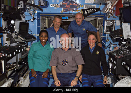 NASA Space Shuttle Discovery International Space Station STS-121 mission prime crew member American astronaut (front, L-R) Stephanie Wilson, Expedition 13 prime crew member American astronaut Jeffrey Williams, and STS-121 prime crew members American astronaut Lisa Nowak, (back, L-R) Piers Sellers, and Mark Kelly pose for a group photo in the ISS Destiny Laboratory July 14, 2006 in Earth orbit. Stock Photo