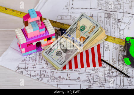 Construction plans with helmet and drawing tools on blueprints instruments on the worktable Stock Photo