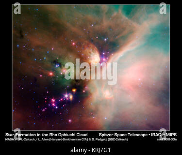 Newborn stars peek out from beneath their natal blanket of dust in this ...