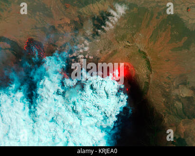 NASA image acquired June 24, 2011  Since it began erupting on June 12, 2011, emissions from Eritrea’s Nabro Volcano have drifted over much of East Africa and the Middle East. Ash has displaced residents living near the volcano and disrupted flights in the region. Despite the volcano’s widespread effects, little is known about the eruption. Nabro is located in an isolated region along the border between Eritrea and Ethiopia, and few English-language reports have been published. Satellite remote sensing is currently the only reliable way to monitor the ongoing eruption. This pair of satellite im Stock Photo