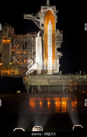 The space shuttle Atlantis is seen shortly after the rotating service structure (RSS) was rolled back at launch pad 39a, Thursday, July 7, 2011 at the NASA Kennedy Space Center in Cape Canaveral, Fla.  Atlantis is set to liftoff Friday, July 8, on the final flight of the shuttle program, STS-135, a 12-day mission to the International Space Station.  Photo Credit: (NASA/Bill Ingalls) STS-135 (side view) on rotating service structure Stock Photo