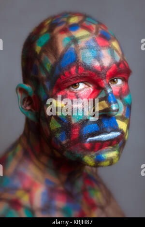 Serious villain colorful face looking at you Stock Photo