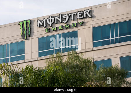 A logo sign outside of the headquarters of the Monster Beverage Corporation in Corona, California on December 9, 2017. Stock Photo