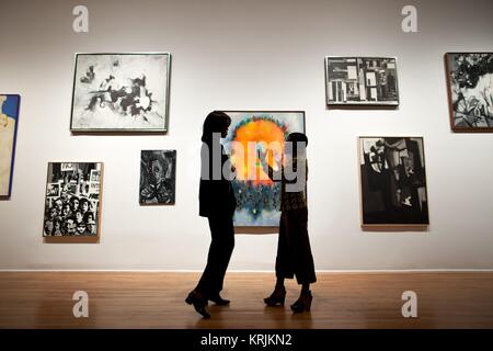 U.S. First Lady Michelle Obama (left) talks with Studio Museum Director and Chief Curator Thelma Golden during a tour of the Harlem gallery September 21, 2011 in New York City, New York. Stock Photo