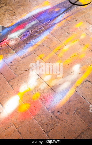 Colorful light spots on the the floor in church Stock Photo