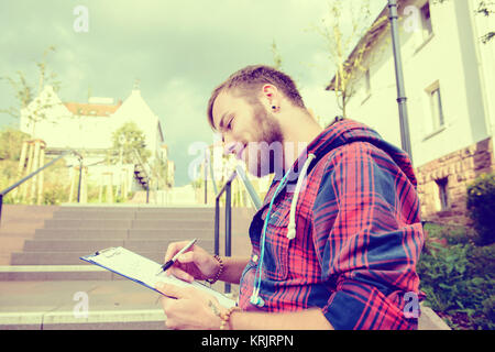 young man is reading a book Stock Photo