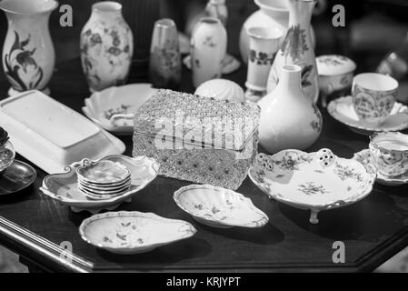 close up on porcelain plates placed on the cement floor Stock Photo