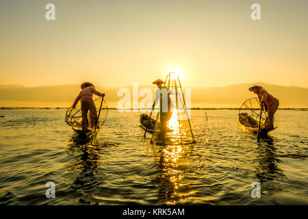 Fishermen at sunrise in the Landscape on the Inle Lake in the Shan State in the east of Myanmar in Southeastasia, myanmar, inle lake