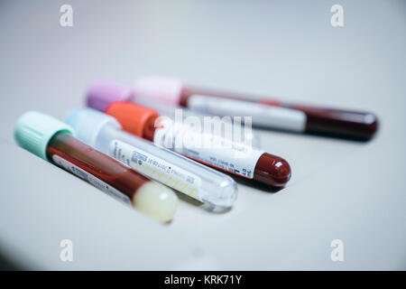 Test tubes with caps on table Stock Photo