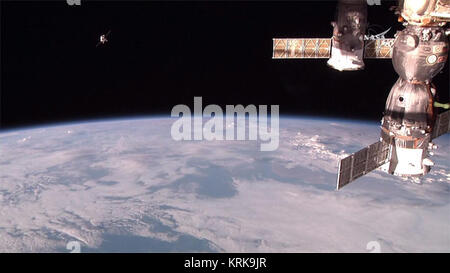 epa04959884 A handout image made available 02 October 2015 by NASA, showing the  high-definition camera on the International Space Station spotting the Progress 61 resupply vehicle (upper L) just minutes before it docked to the Zvezda service module of tie International Space Station, ISS. The Progress M-29M ship was launched 01 October with a Soyuz carrier rocket at the Baikonur Cosmodrome, which Russia leases in the former Soviet nation of Kazakhstan. The craft is carrying 1.5 tonnes of dry cargo, including 430 kilograms of food. It also carries another 420 kilograms of water, 350 kilograms  Stock Photo