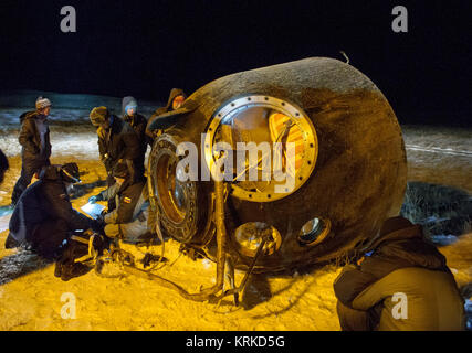 The Soyuz TMA-17M spacecraft is seen after it landed with Expedition 45 crew members Oleg Kononenko of the Russian Federal Space Agency (Roscosmos), Kjell Lindgren of NASA and Kimiya Yui of the Japan Aerospace Exploration Agency (JAXA) near the town of Zhezkazgan, Kazakhstan on Friday, Dec. 11, 2015. Kononenko, Lindgren, and Yui are returning after 141 days in space where they served as members of the Expedition 44 and 45 crews onboard the International Space Station. Photo Credit: (NASA/GCTC/Andrey Shelepin) Expedition 45 Soyuz TMA-17M Landing (NHQ201512110018) Stock Photo