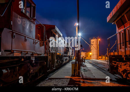 CPR locos a the fueling rack in Kipp Yard at night in Lethbridge - Alberta Stock Photo