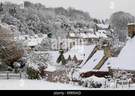 Chedworth village in the december snow. Chedworth, Cotswolds, Gloucestershire, England Stock Photo