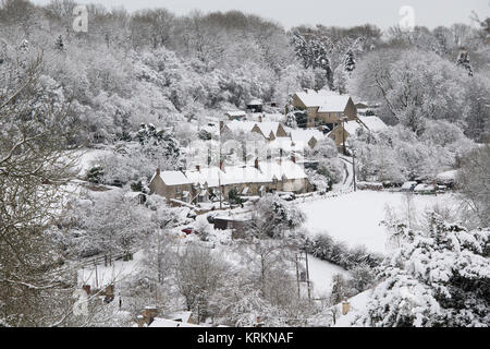 Chedworth village in the december snow. Chedworth, Cotswolds, Gloucestershire, England Stock Photo