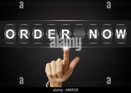 business hand clicking order now on Flipboard Stock Photo