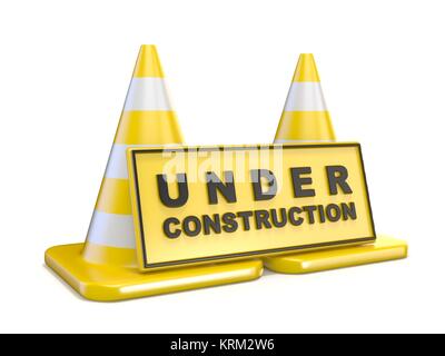 Yellow UNDER CONSTRUCTION sign and two road cones Stock Photo