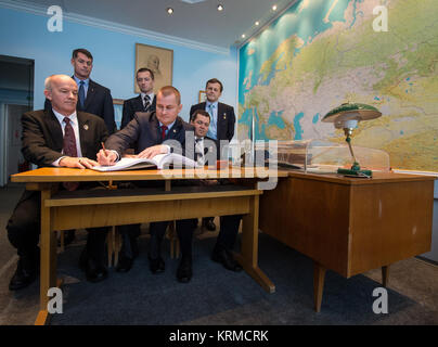 Expedition 47 NASA astronaut Jeff Williams, seated left, Russian cosmonaut Alexei Ovchinin of Roscosmos, seated center, and Russian cosmonaut Oleg Skripochka sign a guest book at the  'Memorial working study of Yuri Gagarin' at the Gagarin Cosmonaut Training Center (GCTC) as backup crew members: NASA astronaut Shane Kimbrough, standing left, Russian cosmonauts Sergei Ryzhikov, and Andrey Borisenko of Roscosmos look on, Friday, Feb. 26, 2016, in Star City, Russia.  The memorial study represents Gagarin's working study in the way it was abandoned by Gagarin on March 27, 1968 before leaving for t Stock Photo