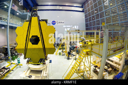 A composite of nine wide-angle images showign the NASA Goddard clean room on May 4, 2016, when the uncovered flight primary mirror of the James Webb Space Telescope was tilted into a vertical position. James Webb Space Telescope Revealed (26764527271)