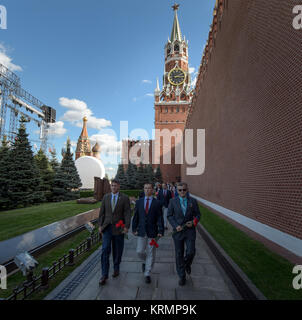 Expedition 49 NASA astronaut Shane Kimbrough, left, Russian cosmonaut Sergei Ryzhikov of Roscosmos, center, and Russian cosmonaut Andrey Borisenko of Roscosmos visit Red Square to lay roses at the site where Russian space icons are interred as part of traditional pre-launch ceremonies, Thursday, Sept. 1, 2016 in Moscow. Photo Credit: (NASA/Bill Ingalls) Expedition 49 Red Square Visit (NHQ201609010009) Stock Photo