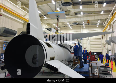 Inside Building 1555 at Vandenberg Air Force Base in California, technicians and engineers perform final wing installations on the Orbital ATK Pegasus XL rocket which will launch eight NASA Cyclone Global Navigation Satellite System, or CYGNSS, spacecraft. When preparations are competed at Vandenberg, the rocket, with CYGNSS in its payload fairing, will be attached to the Orbital ATK L-1011 carrier aircraft and transported to NASA’s Kennedy Space Center in Florida. On Dec. 12, 2016, the carrier aircraft is scheduled to take off from the Skid Strip at Cape Canaveral Air Force Station and CYGNSS Stock Photo