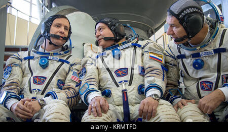 Expedition 50 backup crew members, NASA astronaut Jack Fisher, left, Russian cosmonaut Fyodor Yurchikhin of Roscosmos, center, and ESA astronaut Paolo Nespoli, left,  answer questions from the press ahead of their Soyuz qualification exams, Monday, Oct. 24, 2016, at the Gagarin Cosmonaut Training Center (GCTC) in Star City, Russia. Photo Credit: (NASA/Bill Ingalls) Expedition 50 backup crew members in front of the Soyuz TMA spacecraft mock-up in Star City, Russia Stock Photo