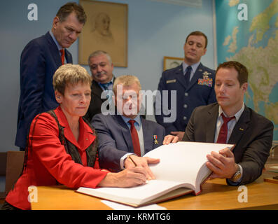 Expedition 50 NASA astronaut Peggy Whitson, seated left, Russian cosmonaut Oleg Novitskiy of Roscosmos, seated center, and ESA astronaut Thomas Pesquet sign a guest book at the  'Memorial working study of Yuri Gagarin' at the Gagarin Cosmonaut Training Center (GCTC) as backup crew members: ESA astronaut Paolo Nespoli, standing left, Russian cosmonaut Fyodor Yurchikhin of Roscosmos, standing center, and NASA astronaut Jack Fischer look on, Wednesday, Oct. 26, 2016, at the Gagarin Cosmonaut Training Center (GCTC) in Star City, Russia. Photo Credit: (NASA/Bill Ingalls) Expedition 50 GCTC Museum V Stock Photo