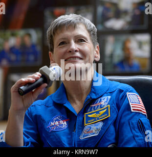 Expedition 50 NASA astronaut Peggy Whitson is seen in quarantine behind glass during a crew press conference, Wednesday, Nov. 16, 2016 at the Cosmonaut Hotel in Baikonur, Kazakhstan. Whitson, Russian cosmonaut Oleg Novitskiy of Roscosmos, and ESA astronaut Thomas Pesquet will launch from the Baikonur Cosmodrome in Kazakhstan the morning of November 18 (Kazakh time.) All three will spend approximately six months on the orbital complex. Photo Credit: (NASA/Bill Ingalls) Expedition 50 Crew Press Conference (NHQ201611160026) Stock Photo
