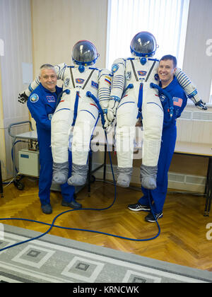 12-42-38:  In the Integration Building at the Baikonur Cosmodrome in Kazakhstan, Expedition 51 crewmembers Fyodor Yurchikhin of the Russian Federal Space Agency (Roscosmos, left) and Jack Fischer of NASA (right) pose for pictures April 6 with their Russian Sokol launch and entry suits as part of pre-launch training preparations. Fischer and Yurchikhin will launch April 20 on the Soyuz MS-04 spacecraft for a four and a half month mission on the International Space Station.  NASA/Gagarin Cosmonaut Training Center/Andrey Shelepin Soyuz MS-04 crew members with their space suits Stock Photo