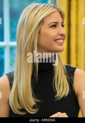 President Donald Trump, joined by First Daughter Ivanka Trump talks with NASA astronauts Peggy Whitson and Jack Fischer onboard the International Space Station Monday, April 24, 2017 from the Oval Office of the White House in Washington. The President congratulated Whitson for breaking the record for cumulative time spent in space by a U.S. astronaut. The President and First Daughter were also joined by NASA astronaut Kate Rubins and discussed with the three astronauts what it is like to live and work on the orbiting outpost as well as the importance of STEM.  Photo Credit: (NASA/Bill Ingalls) Stock Photo