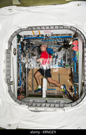 ISS-53 Mark Vande Hei jogs on a treadmill inside the Tranquility module Stock Photo