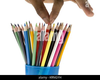 picking the red pencils Stock Photo