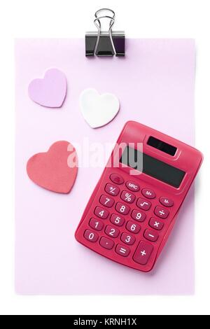 pink sheet calculator heart shaped and paper clip Stock Photo