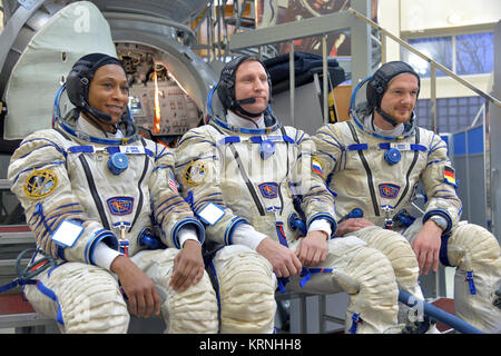 At the Gagarin Cosmonaut Training Center in Star City, Russia, Expedition 54-55 backup crewmembers Jeanette Epps of NASA (left), Sergey Prokopyev of the Russian Federal Space Agency (Roscosmos, center) and Alexander Gerst of the European Space Agency (right) answer reporters’ questions Nov. 28 as part of their final qualification exam activities. They are serving as backups to the prime crew, Anton Shkaplerov of Roscosmos, Scott Tingle of NASA and Norishige Kanai of the Japan Aerospace Exploration Agency (JAXA), who will launch Dec. 17 on their Soyuz MS-07 spacecraft for a five-month mission o Stock Photo