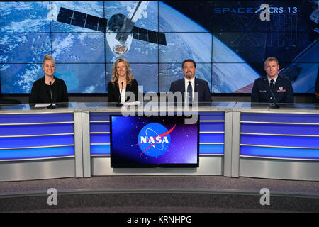 In the Kennedy Space Center’s Press Site auditorium, NASA and industry leaders speak to members of the media during a prelaunch news conference for the SpaceX CRS-13 commercial resupply services mission to the International Space Station. From left are: Cheryl Warner of NASA Communications, Jessica Jensen, SpaceX director of Dragon Mission Management, Kirt Costello, deputy chief scientist for the International Space Station Program Science Office at NASA’s Johnson Space Center in Houston, and Lt. David Myers, weather officer for the 45th Weather Squadron. Kirk Shireman, International Space Sta Stock Photo